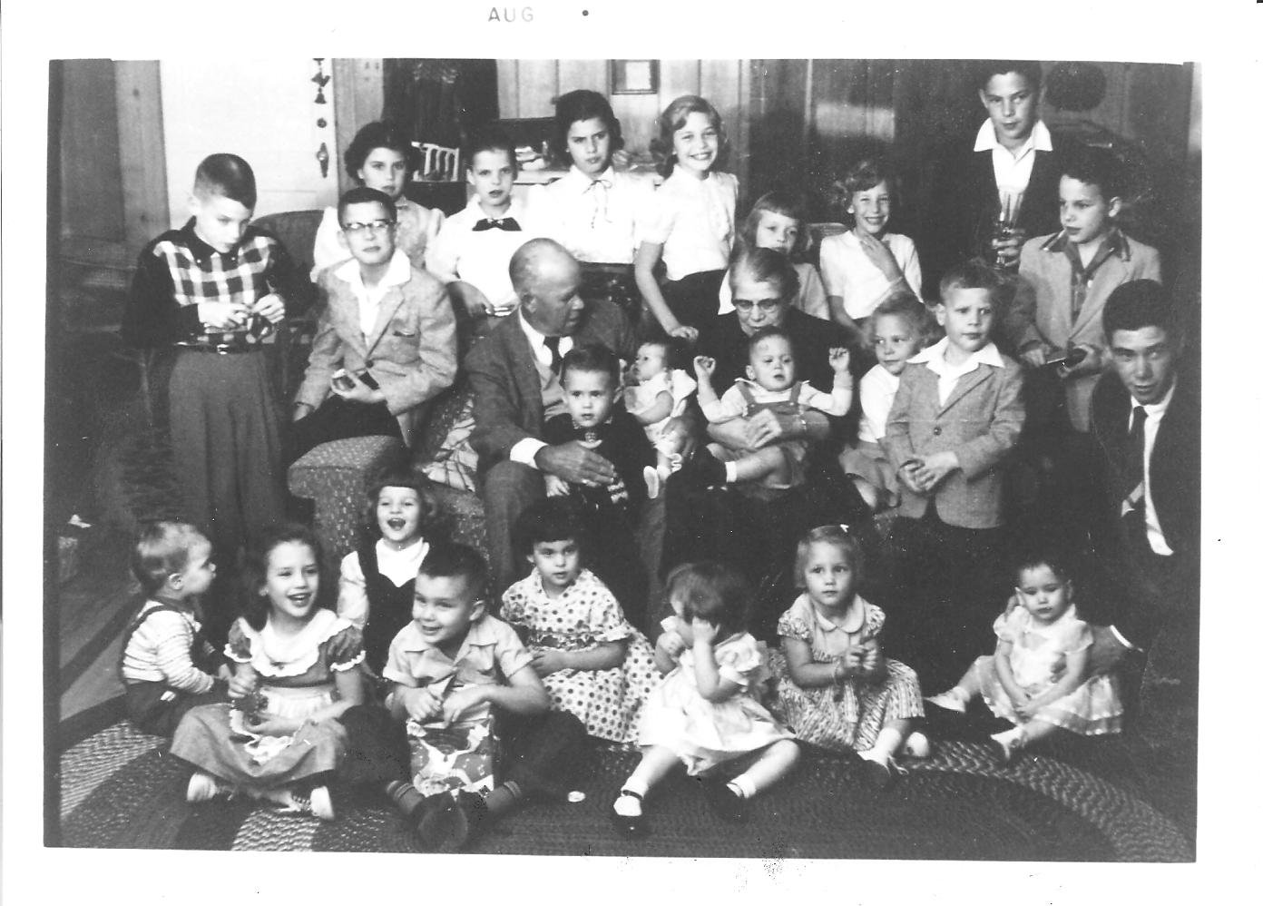 More than twenty cousins of every age crowded into a panelled living room around their seated grandparents, the smallest children sitting on a braided rug at the front.